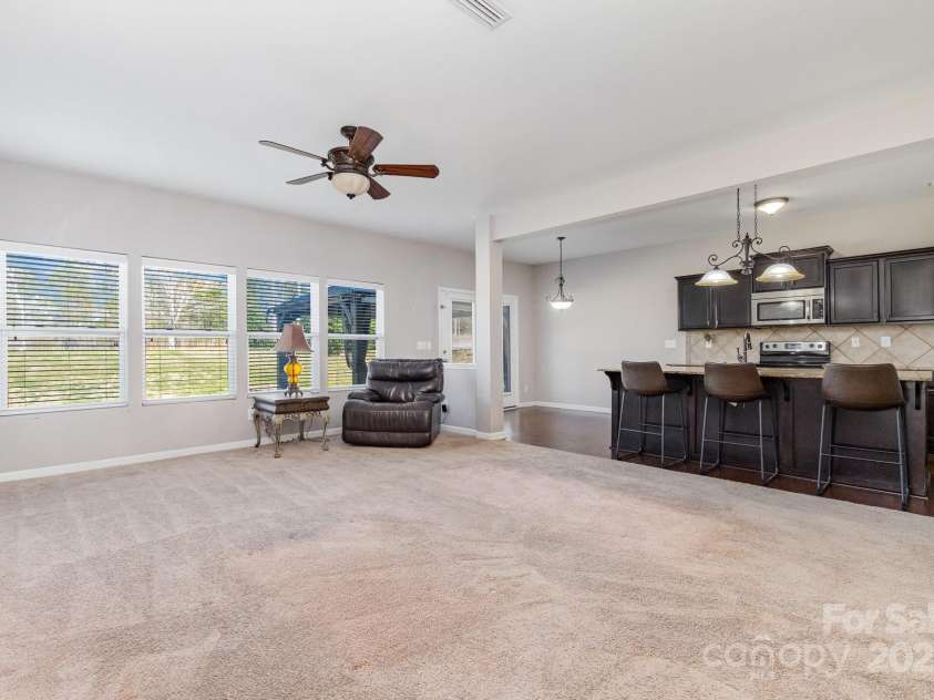887 Pointe Andrews Drive, Concord, NC 28025.  MLS# CAR4238004, YatesRealty ID 11906. The extensive family room is filled with natural light.