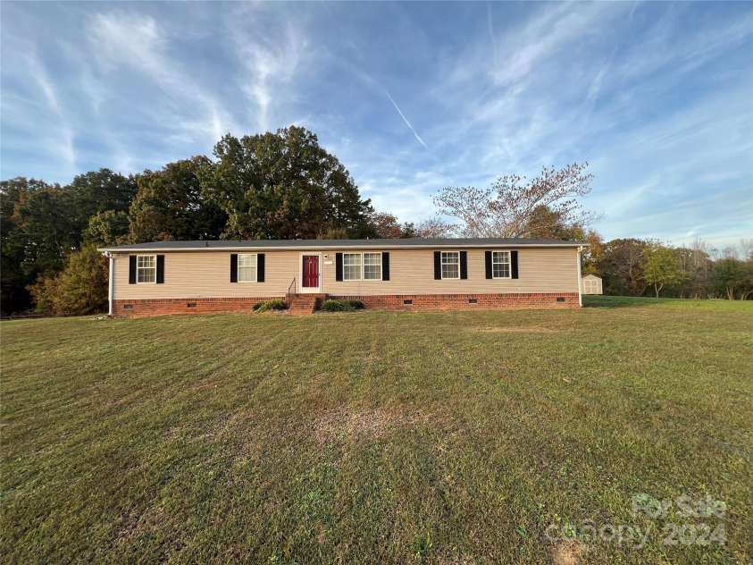 36245 Nugget Road, New London, NC 28127.  MLS# CAR4197702, YatesRealty ID 11909. Front from center yard