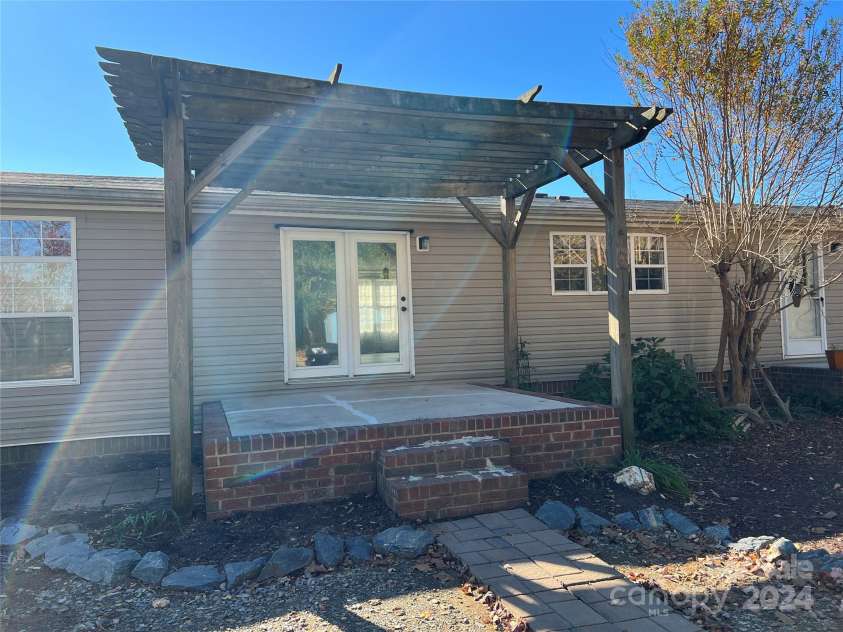 36245 Nugget Road, New London, NC 28127.  MLS# CAR4197702, YatesRealty ID 11909. Patio with pergola