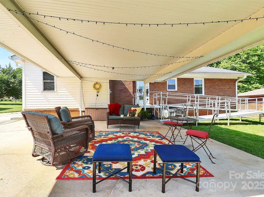 704 Kingman Drive, Charlotte, NC 28217.  MLS# CAR4251916, YatesRealty ID 11913. Carport - back porch