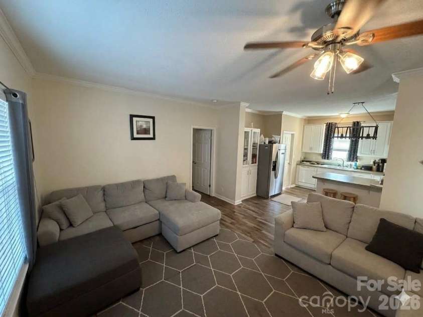 3233 Alamo Drive, Trinity, NC 27370.  MLS# CAR4356868, YatesRealty ID 11918. Living Room and Kitchen - Photo Virtually Edited