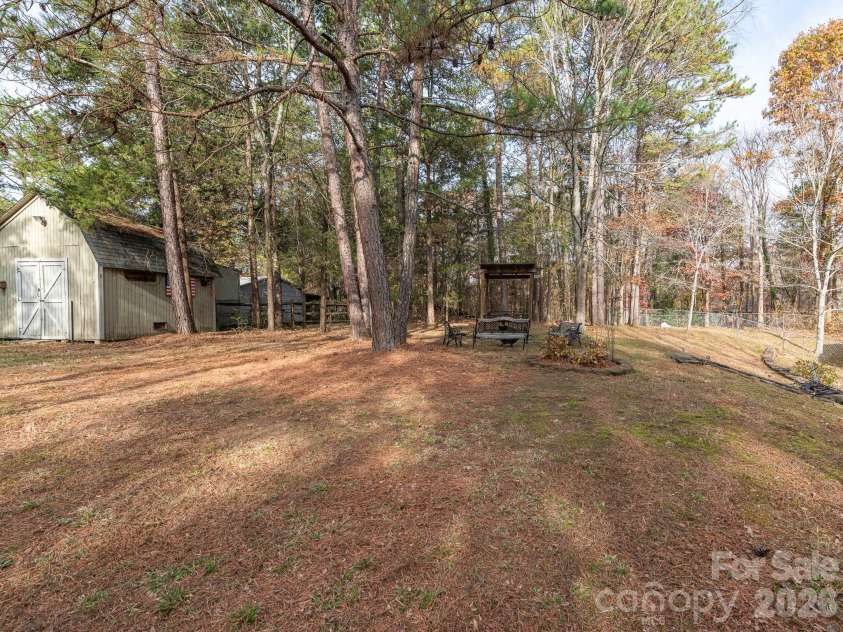 1800 Lake Lynn Road, Concord, NC 28025.  MLS# CAR4316180, YatesRealty ID 11927. BACK YARD WITH WORKSHOP, ELECTRICAL AND PLENTY OF STORAGE
