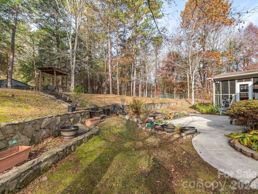 1800 Lake Lynn Road, Concord, NC 28025.  MLS# CAR4316180, YatesRealty ID 11927. STONE RETAINING WALL/STEPS