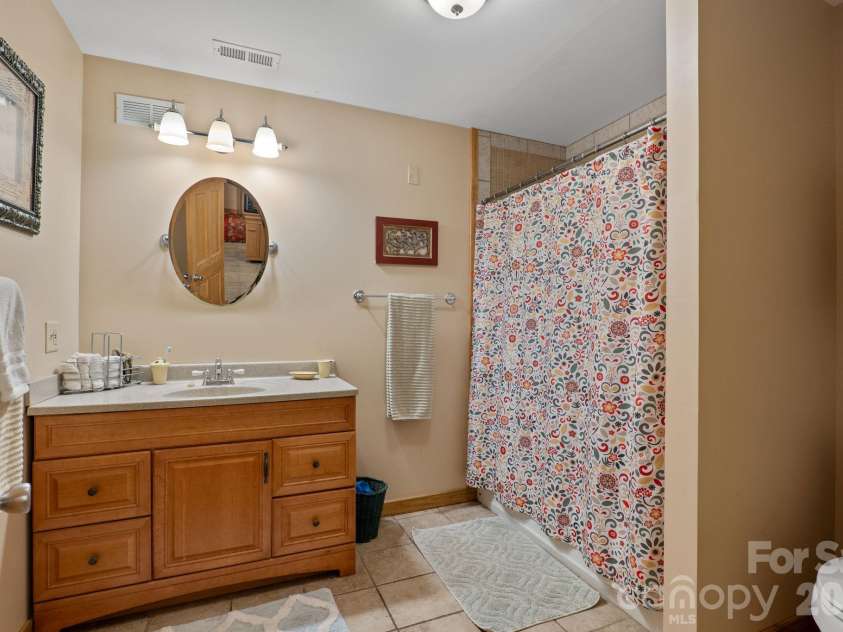 150 Avondale Ridge Road, Asheville, NC 28803.  MLS# CAR4355804, YatesRealty ID 11932. Basement full bath