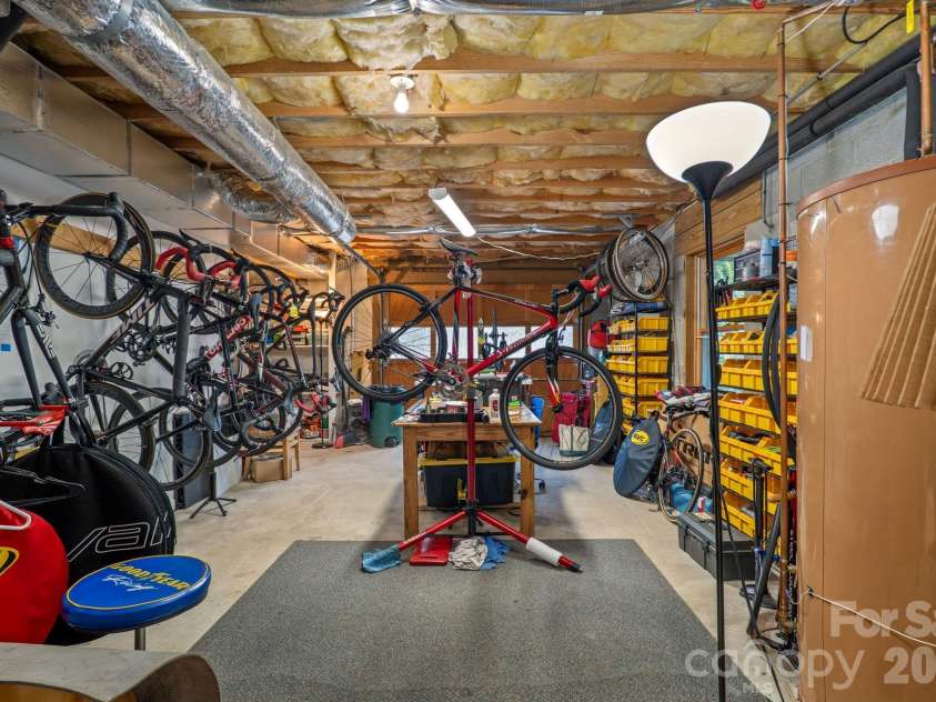 150 Avondale Ridge Road, Asheville, NC 28803.  MLS# CAR4355804, YatesRealty ID 11932. Garage is already set up for cyclists!