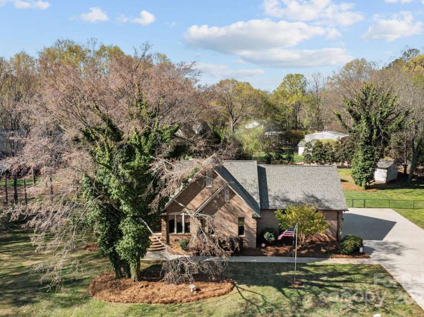 7146 Sifford Road, Stanley, NC 28164.  MLS# CAR4238571, YatesRealty ID 11937. Aerial of front of home