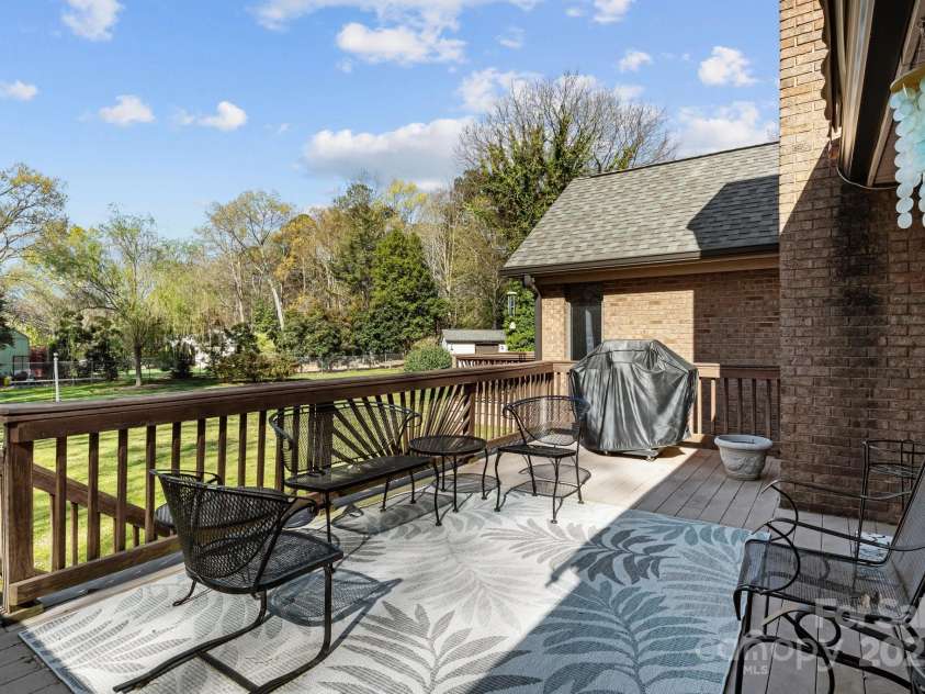 7146 Sifford Road, Stanley, NC 28164.  MLS# CAR4238571, YatesRealty ID 11937. Large deck over looking expansive backyard