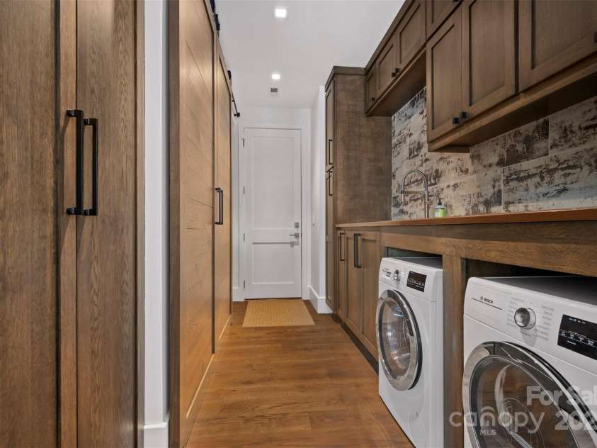 984 Mapleton Lane, Columbus, NC 28722.  MLS# CAR4240972, YatesRealty ID 11938. Mudroom with large pantry, barn doors and laundry.