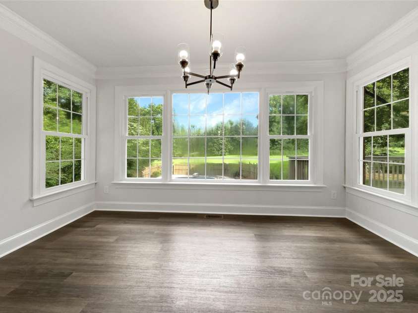8117 Shannon Woods Lane, Matthews, NC 28104.  MLS# CAR4285282, YatesRealty ID 11940. 