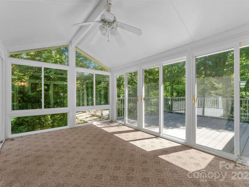 85 Tall Poplar Summit, Hendersonville, NC 28739.  MLS# CAR4185723, YatesRealty ID 11940. Sunroom off of the family room
