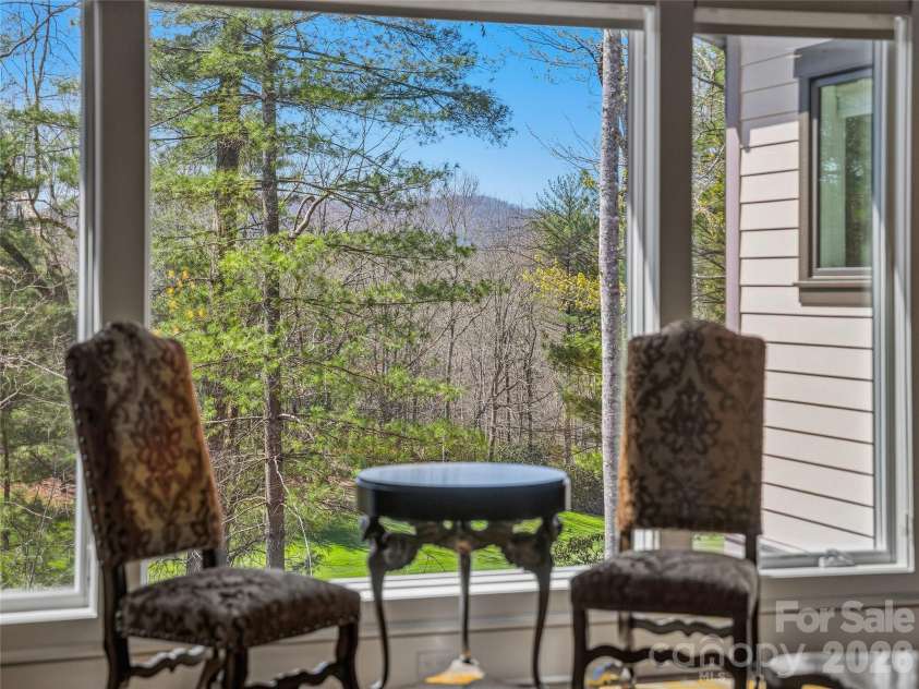 145 Chattooga Run, Hendersonville, NC 28739.  MLS# CAR4360363, YatesRealty ID 11941. Oversized windows provide the perfect backdrop