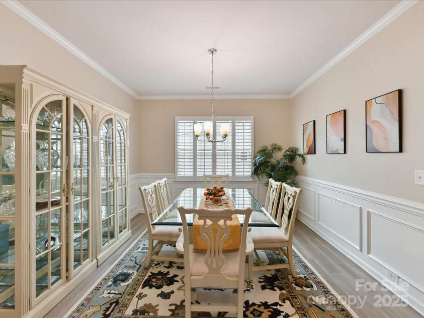 3333 Oliver Stanley Trail, Lancaster, SC 29720.  MLS# CAR4251729, YatesRealty ID 11943. Dining Rm with Planation Shutters, Crown, Chair and Picture Frame Moldings