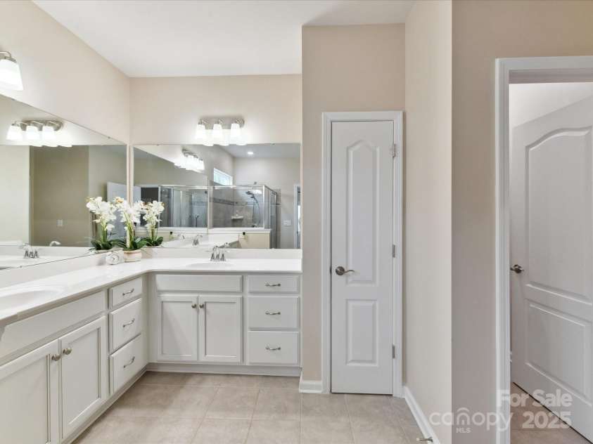 3333 Oliver Stanley Trail, Lancaster, SC 29720.  MLS# CAR4251729, YatesRealty ID 11943. Primary Bath Large Vanity. Tiled Flooring, Walk in Closet and Linen Closet