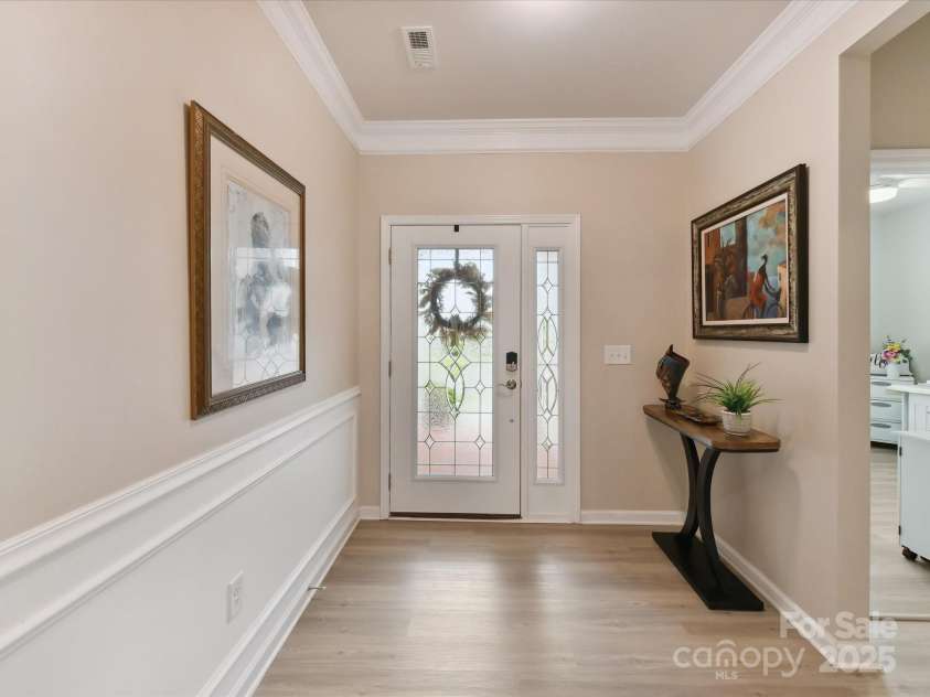 3333 Oliver Stanley Trail, Lancaster, SC 29720.  MLS# CAR4251729, YatesRealty ID 11943. Upgraded Leaded Glass Front Door and Side Panel. Moldings Crown, Chair and Picture Frame