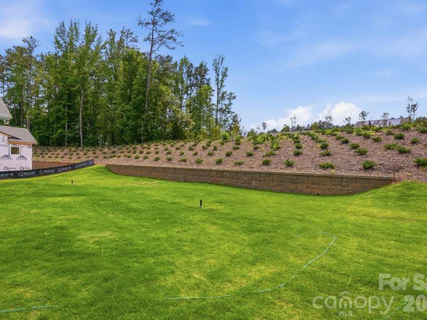 5062 McLaughlin Loop, Waxhaw, NC 28173.  MLS# CAR4349436, YatesRealty ID 11945. Backyard