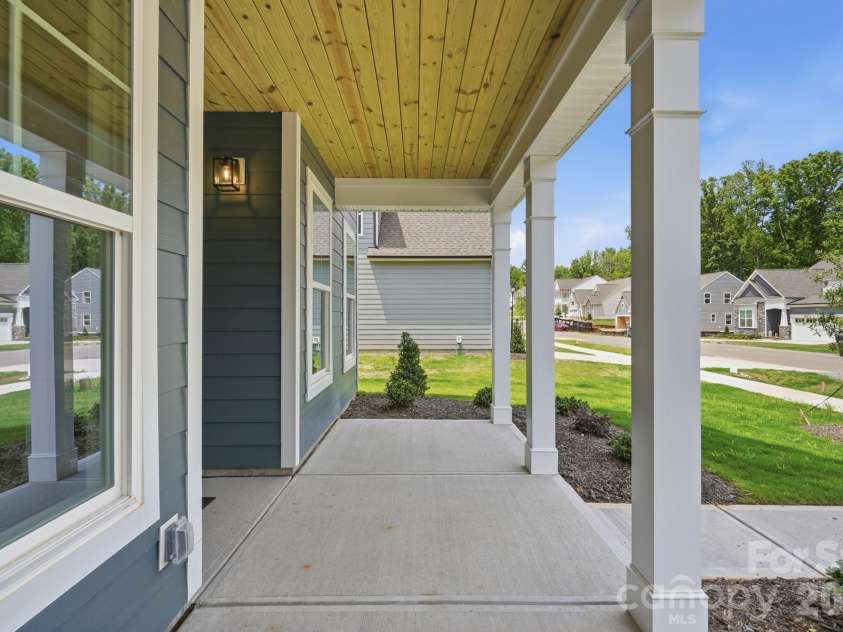 5062 McLaughlin Loop, Waxhaw, NC 28173.  MLS# CAR4349436, YatesRealty ID 11945. Front porch
