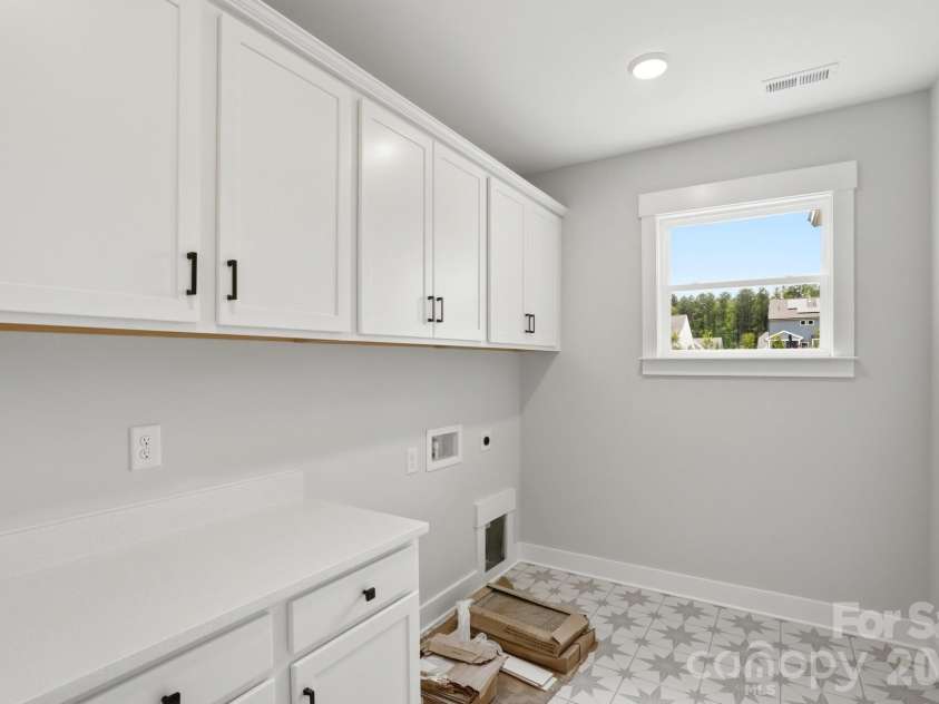 5062 McLaughlin Loop, Waxhaw, NC 28173.  MLS# CAR4349436, YatesRealty ID 11945. Laundry Room