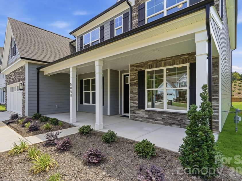 5058 McLaughlin Loop, Waxhaw, NC 28173.  MLS# CAR4351351, YatesRealty ID 11946. Front porch