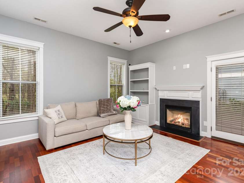 9832 Sunriver Road, Huntersville, NC 28078.  MLS# CAR4241388, YatesRealty ID 11949. Large Size great room with built-in shelving and gas fireplace