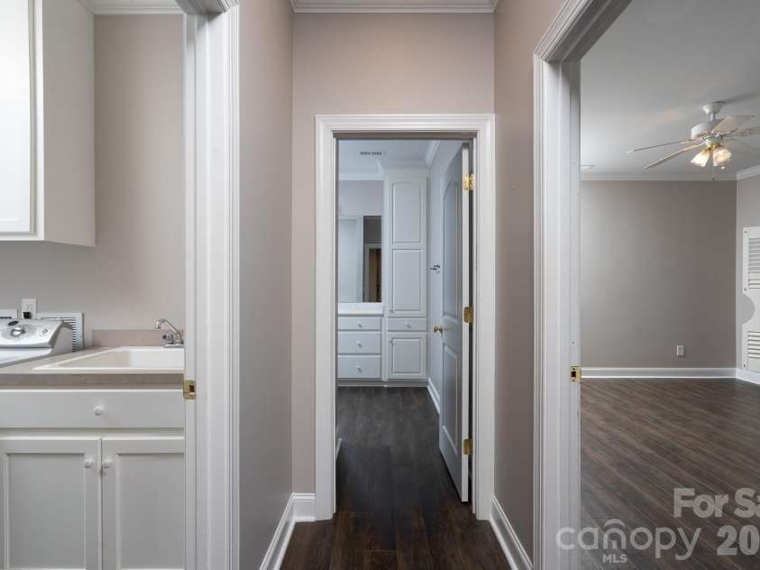 338 Plantation Way, Mount Gilead, NC 27306.  MLS# CAR4335615, YatesRealty ID 1195. Basement Hallway showing location of laundry, bathroom and bedroom.