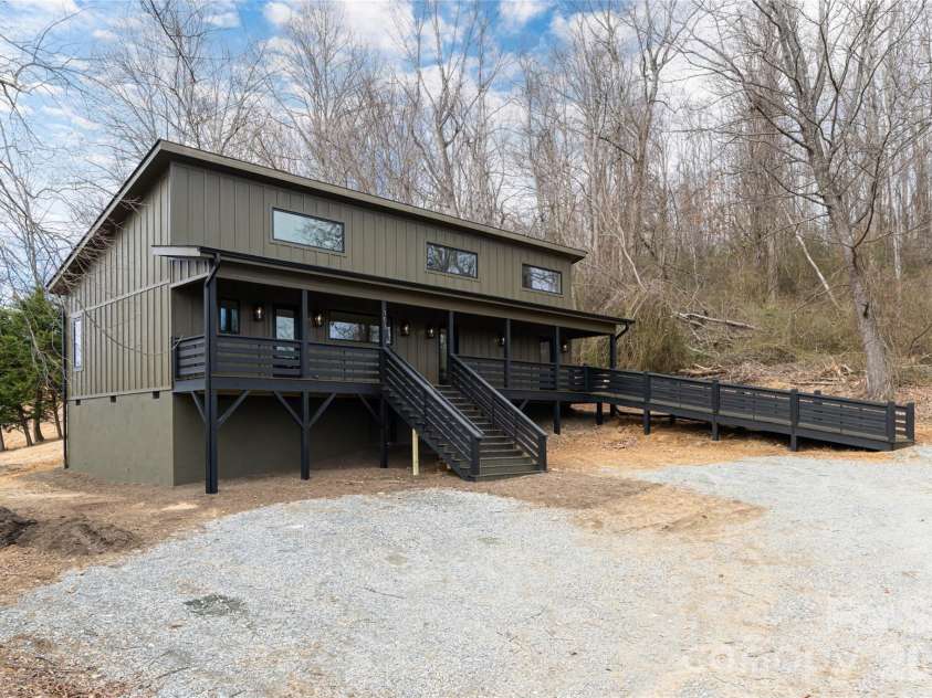 153 Hackleburg Lane, Hendersonville, NC 28792.  MLS# CAR4328212, YatesRealty ID 11954. Clean modern mountain exterior design