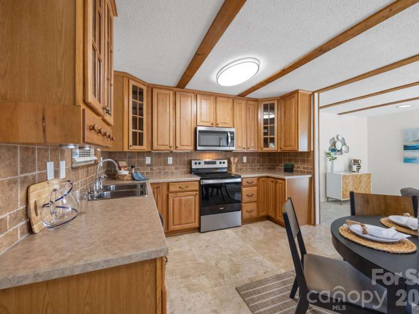 4278 Harbor Lane, Sherrills Ford, NC 28673.  MLS# CAR4346441, YatesRealty ID 11955. Open floor plan.  View from kitchen into the living area.