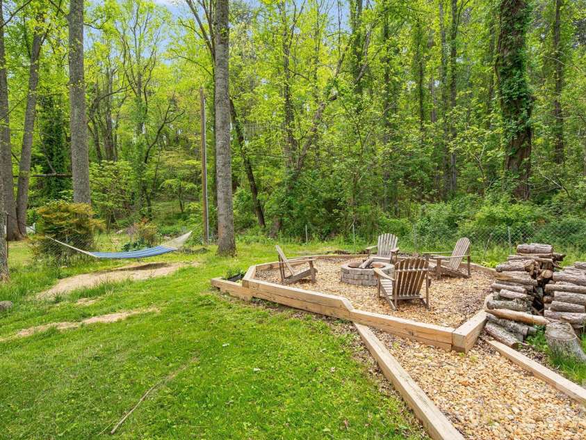101 McFalls Road, Asheville, NC 28805.  MLS# CAR4254277, YatesRealty ID 11959. Over an Acre for humans and furry friend to frolic.