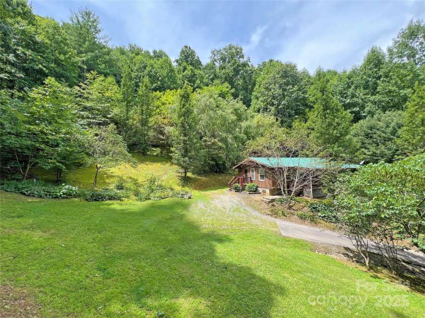 833 Sprinkle Branch Road, Marshall, NC 28753.  MLS# CAR4166794, YatesRealty ID 11960. Private cabin on 16+ acres