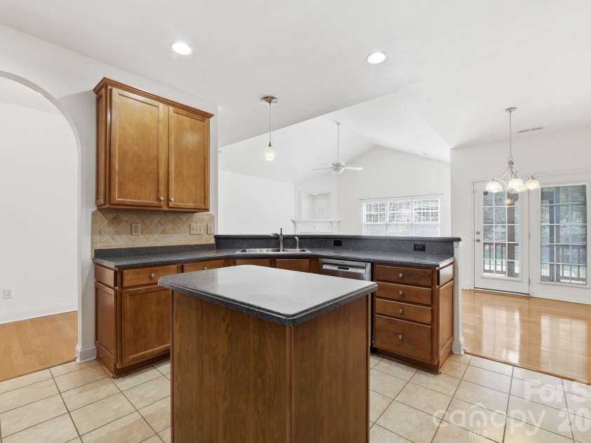 5007 Symphony Lane, Indian Trail, NC 28079.  MLS# CAR4364786, YatesRealty ID 11963. Eat in kitchen featuring corian counters