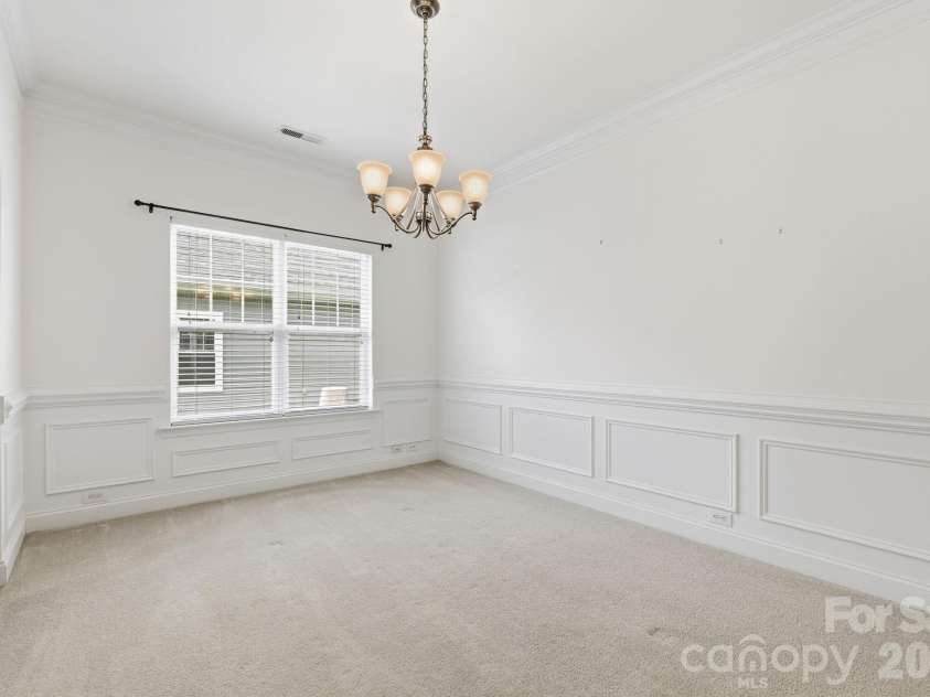 5007 Symphony Lane, Indian Trail, NC 28079.  MLS# CAR4364786, YatesRealty ID 11963. Extensive molding in dining room