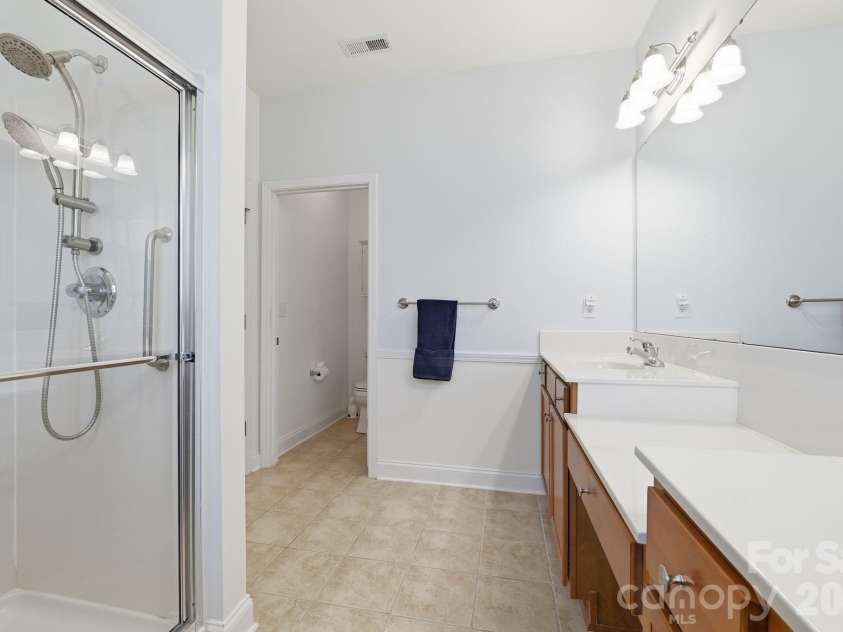 5007 Symphony Lane, Indian Trail, NC 28079.  MLS# CAR4364786, YatesRealty ID 11963. Large walk in shower 