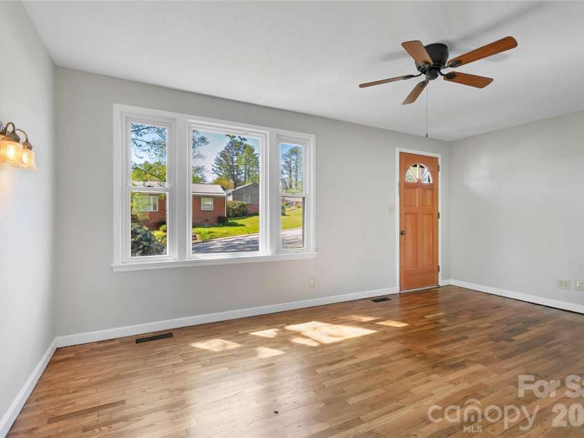 19 Trowbridge Lane, Brevard, NC 28712.  MLS# CAR4342607, YatesRealty ID 11965. Newly refinished floors