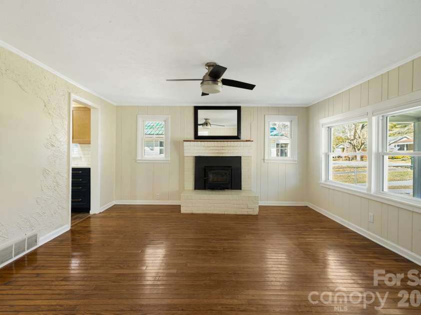 1015 Mountain View Street, Hendersonville, NC 28739.  MLS# CAR4344804, YatesRealty ID 11991. Wood burning fire insert in brck fireplace