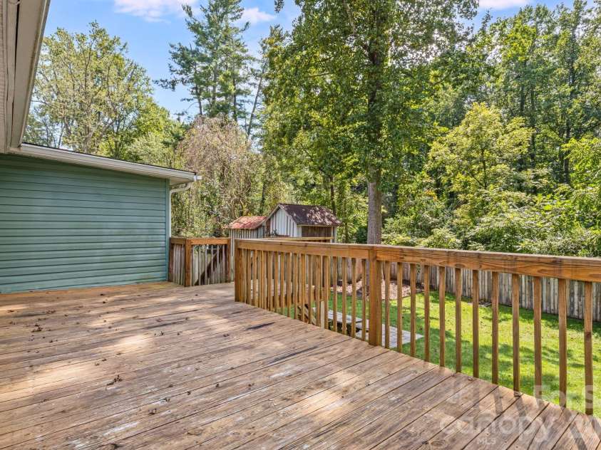 1015 Mountain View Street, Hendersonville, NC 28739.  MLS# CAR4425297, YatesRealty ID 11991. Large deck overlooking backyard.