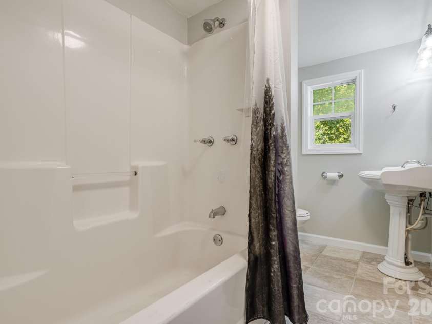1015 Mountain View Street, Hendersonville, NC 28739.  MLS# CAR4425297, YatesRealty ID 11991. Primary bath.
