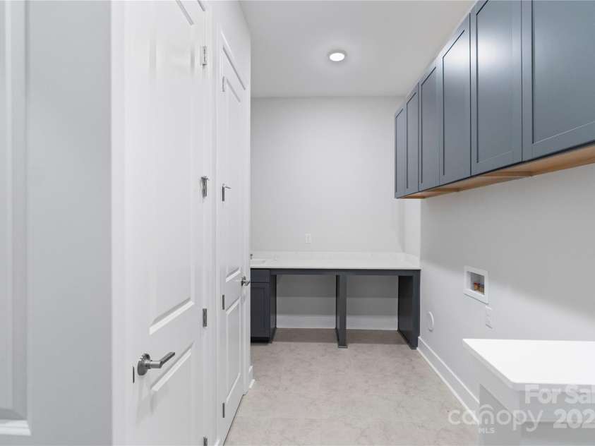 1132 Meander Lane, Waxhaw, NC 28173.  MLS# CAR4238034, YatesRealty ID 11995. Laundry room with folding table