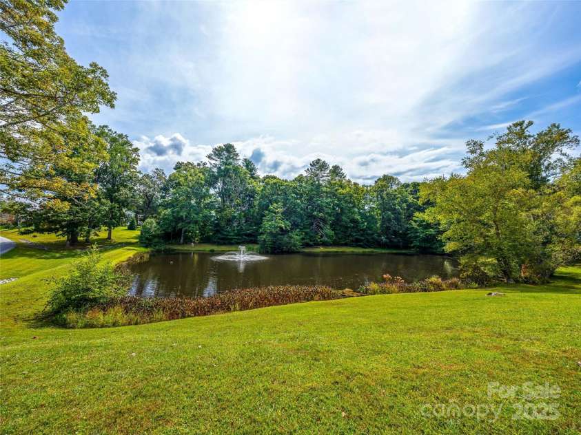 83 Farm Lane, Mills River, NC 28759.  MLS# CAR4303324, YatesRealty ID 12. Community pond