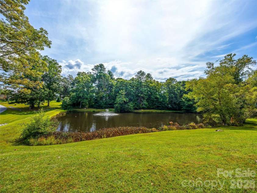 83 Farm Lane, Mills River, NC 28759.  MLS# CAR4303324, YatesRealty ID 12. Community pond