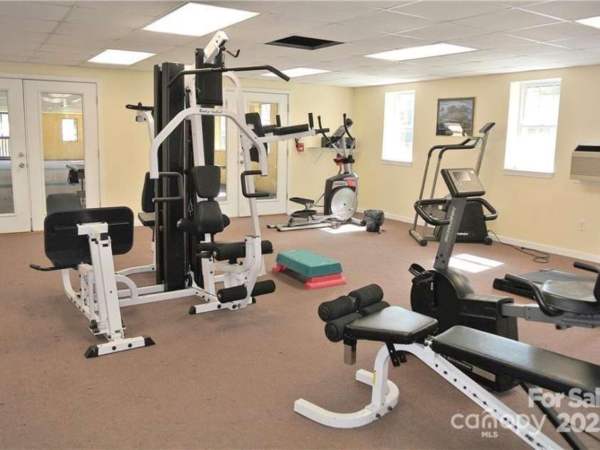 83 Farm Lane, Mills River, NC 28759.  MLS# CAR4303324, YatesRealty ID 12. Exercise room in club house