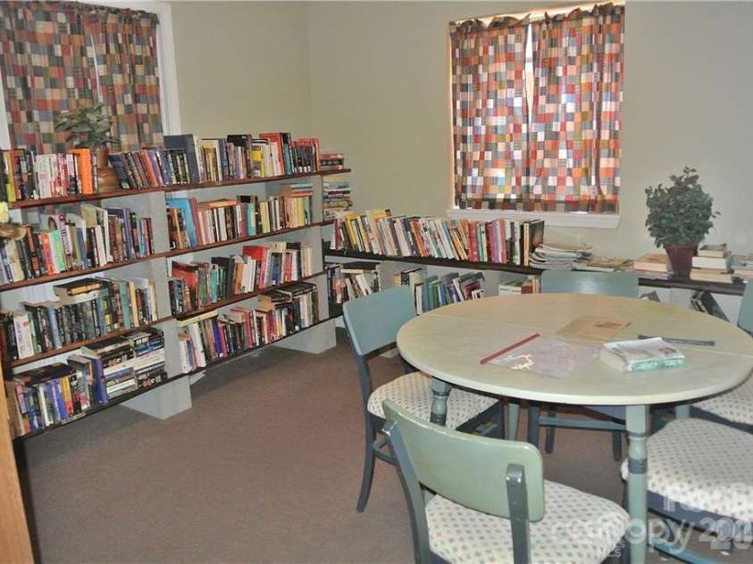 83 Farm Lane, Mills River, NC 28759.  MLS# CAR4303324, YatesRealty ID 12. Library in clubhouse
