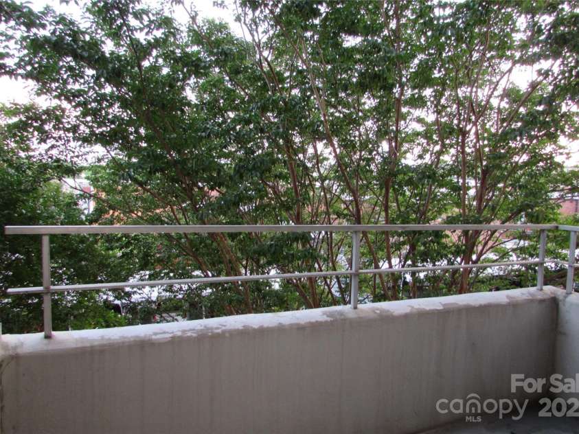 1300 Reece Road, Charlotte, NC 28209.  MLS# CAR4185948, YatesRealty ID 1200. Balcony overlooking bridge to Park Rd Shopping Center