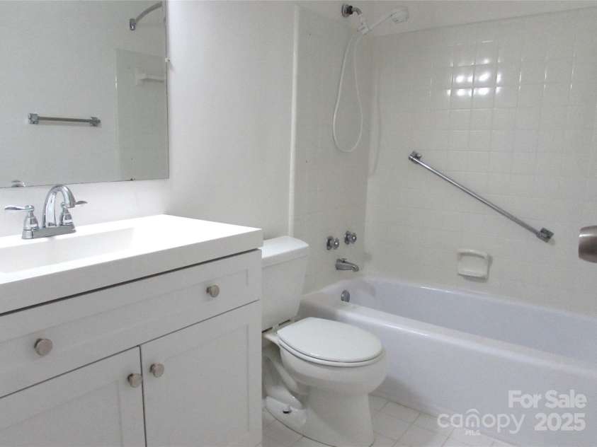 1300 Reece Road, Charlotte, NC 28209.  MLS# CAR4185948, YatesRealty ID 1200. Bathroom has new vanity & faucets