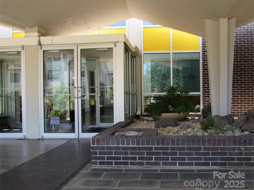 1300 Reece Road, Charlotte, NC 28209.  MLS# CAR4185948, YatesRealty ID 1200. Double doors lead into The Kimberlee