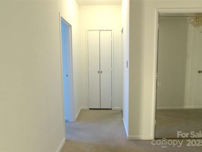 1300 Reece Road, Charlotte, NC 28209.  MLS# CAR4185948, YatesRealty ID 1200. Hallway leading to BR & BA