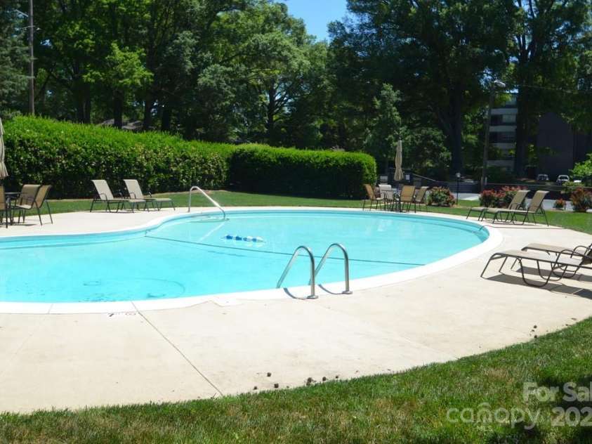 1300 Reece Road, Charlotte, NC 28209.  MLS# CAR4185948, YatesRealty ID 1200. Inground pool w/natural area