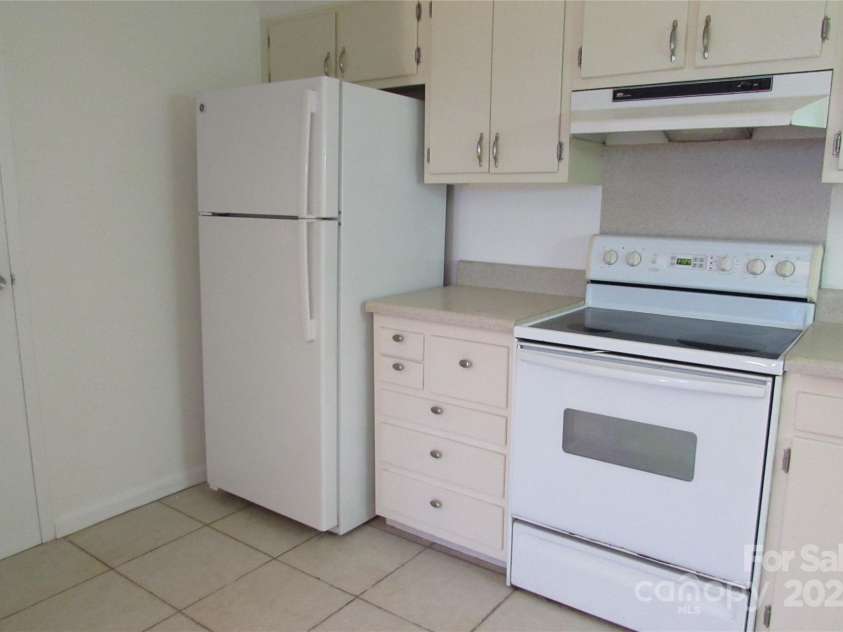 1300 Reece Road, Charlotte, NC 28209.  MLS# CAR4185948, YatesRealty ID 1200. Left side of kitchen - refrigerator does convey
