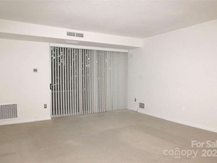 1300 Reece Road, Charlotte, NC 28209.  MLS# CAR4185948, YatesRealty ID 1200. Living room - looking to left