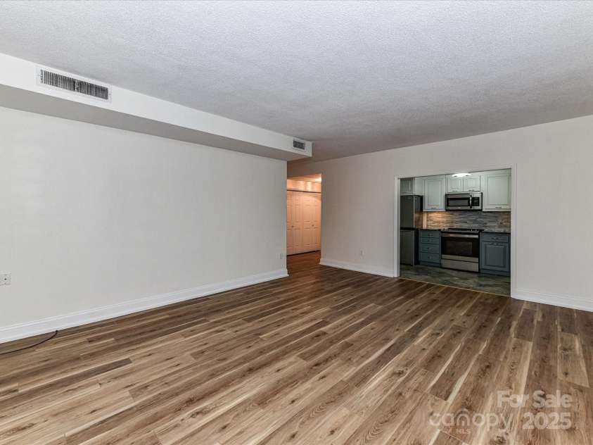 1300 Reece Road, Charlotte, NC 28209.  MLS# CAR4318620, YatesRealty ID 1200. Family Room Area with view towards the Kitchen