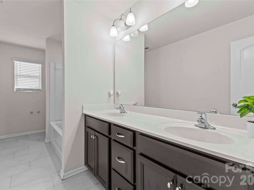 9032 Willowfield Drive, Charlotte, NC 28269.  MLS# CAR4345914, YatesRealty ID 12003. Hall bath with dual sinks