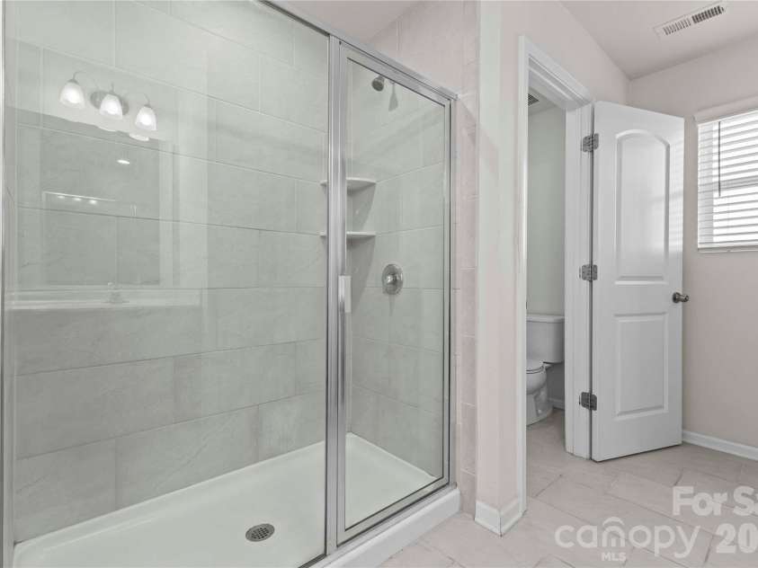 9032 Willowfield Drive, Charlotte, NC 28269.  MLS# CAR4345914, YatesRealty ID 12003. Primary bath